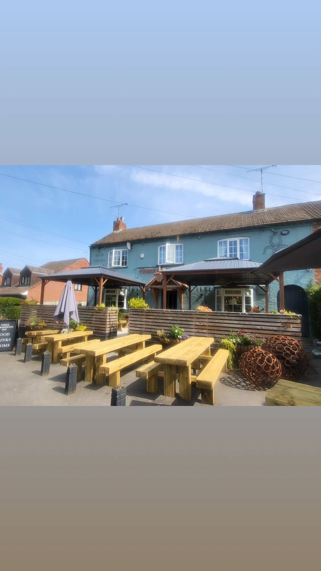 The Three Horseshoes pub frontage (day)